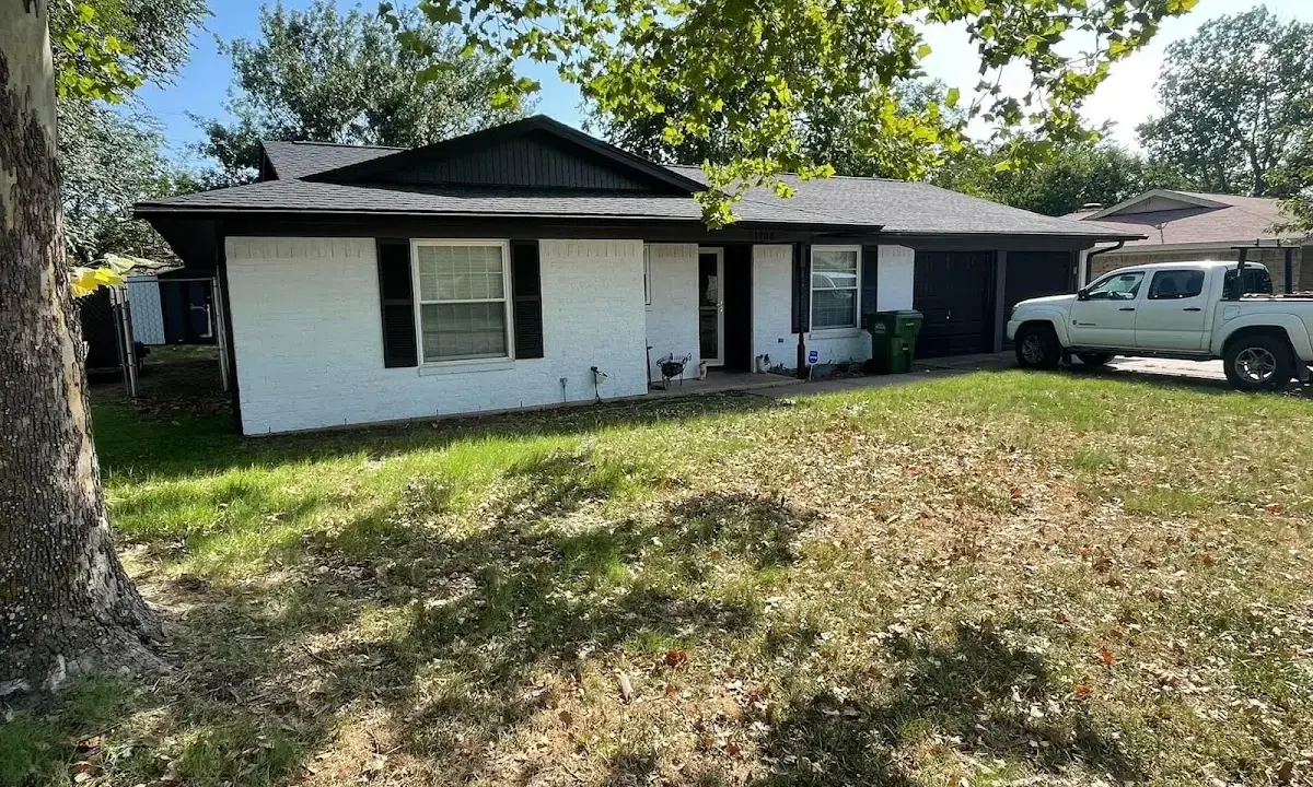 Professional roofing crew working on a residential roof in Middleburg